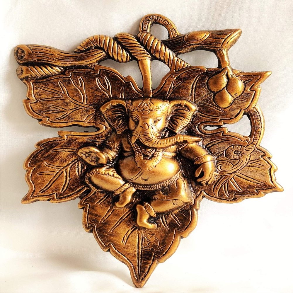 Akriti Brass Art Wares Metal Aluminum Lord Ganesha On Leaf Wall Hanging Statue Size(L*B*H - 19CM*2CM*28CM) 370 Grams, Brass- Golden Antique, 1 Piece