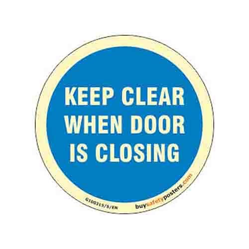 buysafetyposters.com - Keep Clear When Door is Closing Glow Sign - Glow In Dark Eco Vinyl Sticker - 300 mm DIA